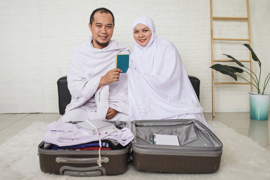 Muslim couple preparing umrah or hajj